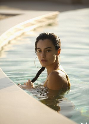 Busty brunette solo girl Silvie A toying trimmed pussy with vibrator